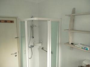 a bathroom with a shower and a glass door at casal do melro in Ericeira +27 photos