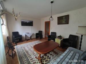 a living room with a table and chairs at Valiant B&B in Otterbäcken
