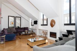 a living room with a couch and a table at Rossio individual Suites Lisbon in Lisbon