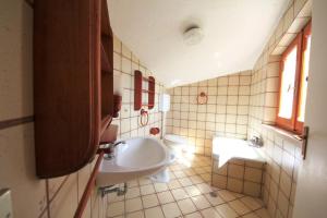 a bathroom with a sink and a tub and a toilet at Villa Pentalocale cod 168- Taunus Vacanze in Numana +22 photos