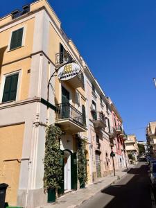 a building with a sign on the side of it at Il Piccolo Albergo Matera in Matera