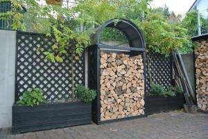 a pile of fire wood in an open gate at Ferienwohnung in Bad Schwalbach in Bad Schwalbach