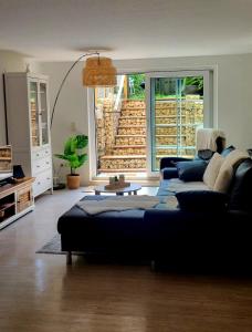 a living room with a couch and a table at MarEwa 80 qm apartment in Mechernich
