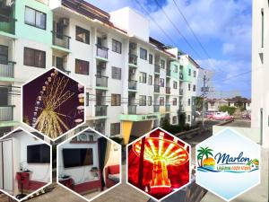 three umbrellas are standing outside of a building at Charm Condo Just Steps from Enchanted Kingdom Sargas in Santa Rosa