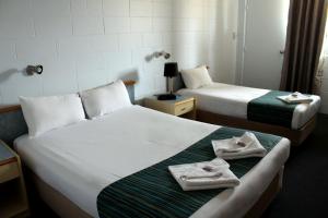 Krevet ili kreveti u jedinici u okviru objekta Rocky Glen Hotel Motel Gladstone