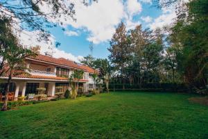 an image of a house with a large yard at Karen Crown 5BR Villa in Nairobi