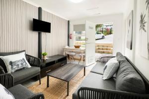 a living room with a couch and a table at Die Kant - Hooggety in George