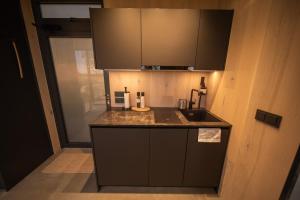 a kitchen with a sink and a counter top at Escape - Bollnäs in Bollnäs +4 photos