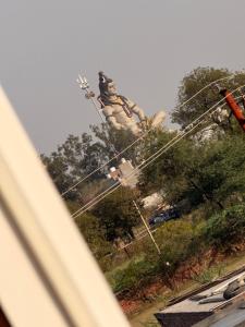 a statue of a man on top of a monument at Sunrise stay in Mathura