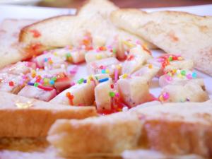a pile of waffles with sprinkles on top of them at Skyline Haven Ella Cabana in Ella