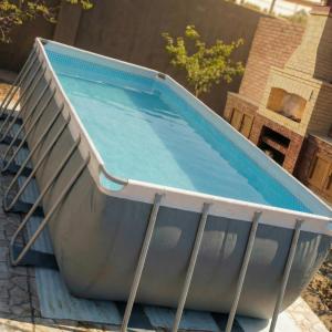 an empty swimming pool in a backyard at Sea View villa in Baku