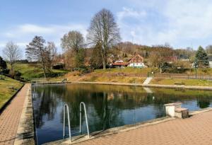 a body of water with two boats in it at Weitblick am Hankehübel in Hohnstein