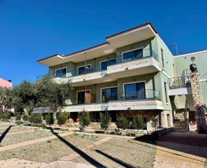 a large building with a lot of windows at Olea Apartments in Potos