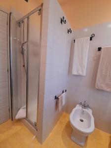 a bathroom with a shower and a toilet at B&B L'Incancellata in Corinaldo +5 photos
