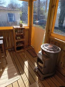 a grill on a porch of a house at Mobile home in Quimper