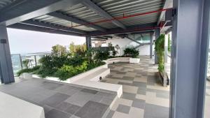 a building with a patio with plants on it at Adilili Mesahill Premier Homestay, Nilai near KLIA USIM AEON Mall Mesa Mall Aurelius Hospital in Nilai
