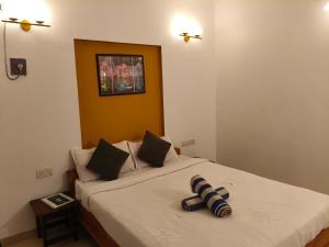 a bedroom with a bed with a white bedspread at Aurelia by Jackfruit in Arambol +31 photos