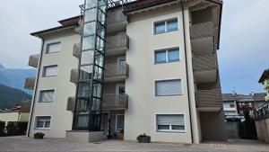 a tall building with balconies on the side of it at Appartamenti Croz del Re 2 in Andalo