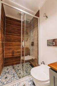 a bathroom with a shower and a toilet at Riserva Urla in Urla