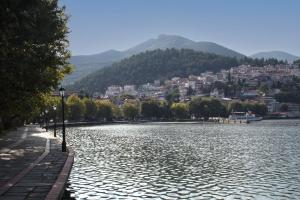 a view of a river with a city in the background at Angels Riva Boutique Residences in Kastoria