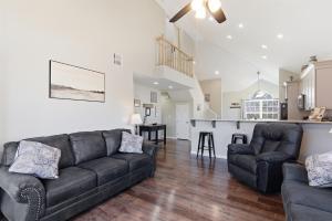 a living room with a couch and a table at Waterfront Condo near Marina in Branson