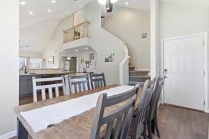 a dining room and kitchen with a table and chairs at Waterfront Condo near Marina in Branson