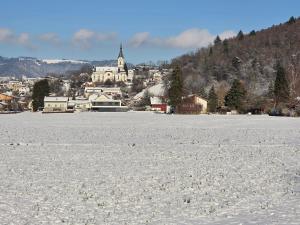a snow covered field with a town in the background at Coraline -Koblach, 6-10 P, 3 Schlafzimmer, Küche, riesige Terrasse, Parkplatz, WiFi, Stellplatz Ski in Koblach