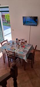 a dining room table with a table cloth on it at Peperilla House in Luni