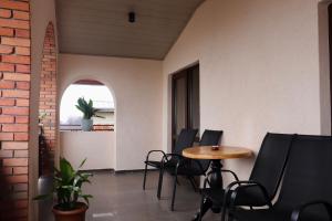 a room with a table and chairs and a window at Hotel Horizont Telavi in Telavi +14 photos