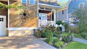 a house with a yard sign on the door at Seamans Folly On Broad in Cape May