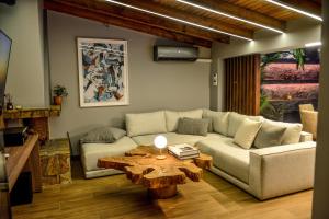 a living room with a couch and a coffee table at Casa Del G in Metókhi