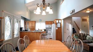 a kitchen and dining room with a table and chairs at Failte in West Cape May