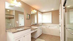 a bathroom with two sinks and a tub and a toilet at 209 Congress Street in Cape May +27 photos