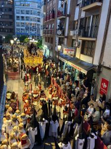 a crowd of people in a street with a crowd of people at Centro apartamento 2-B in Huelva