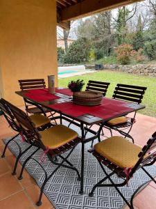 a table and chairs on a patio at Villa Côte & Provence - private heated pool in Fayence