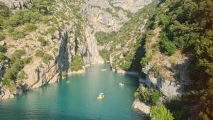 two boats in a river in a canyon at La Cabane douillette in Aups
