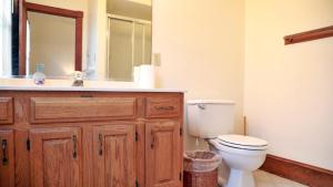 a bathroom with a sink and a toilet and a mirror at Relief Cape May Point in Cape May Point +15 photos