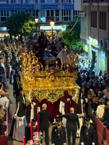 a large crowd of people walking in a street with a float at Apartamento centro 1A in Huelva