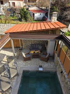 an overhead view of a patio with a swimming pool at Villas Kertezi in Kalavrita