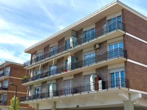 an apartment building with balconies on the side of it at Victoria Seafront - Sea View Private Parking AC & WiFi in Savona
