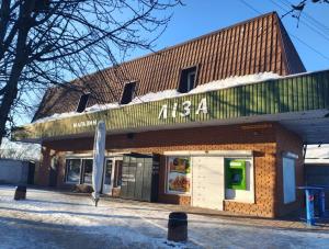 a building with a sign on the front of it at Ліза in Irpin