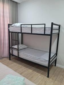 two bunk beds in a room with at Royal Beach Cottage Issyk Kul in Chok-Tal +5 photos
