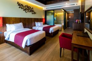 En eller flere senger på et rom på Aonang Phu Pi Maan Resort & Spa