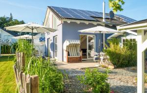 a house with solar panels on the roof at Seebrise B in Süssau
