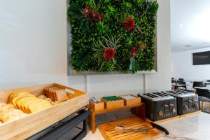a bakery with bread and vegetables on the wall at Cascais Hotel in Cascais