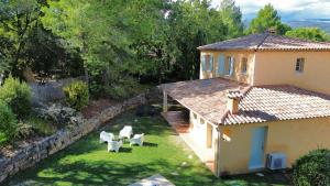 an aerial view of a house with a yard at Villa Côte & Provence - private heated pool in Fayence