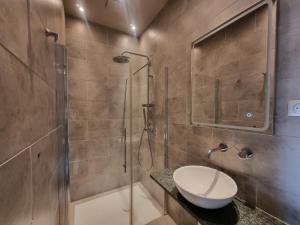a bathroom with a shower and a toilet and a sink at Maison Poche in Caupenne-dʼArmagnac +35 photos
