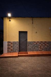 a door on the side of a building at night at Furnished Studio - Cite Progres in Djibouti