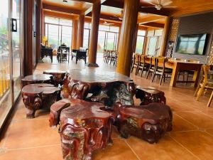 a room with a table and some chairs and tables at Villa KimAnh in Sóc Sơn