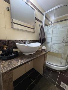a bathroom with a white sink and a shower at MP House Kassandrino Halkidiki in Kassandrinón